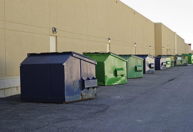 a crowd of dumpsters of all colors and sizes at a construction site in Buffalo IL